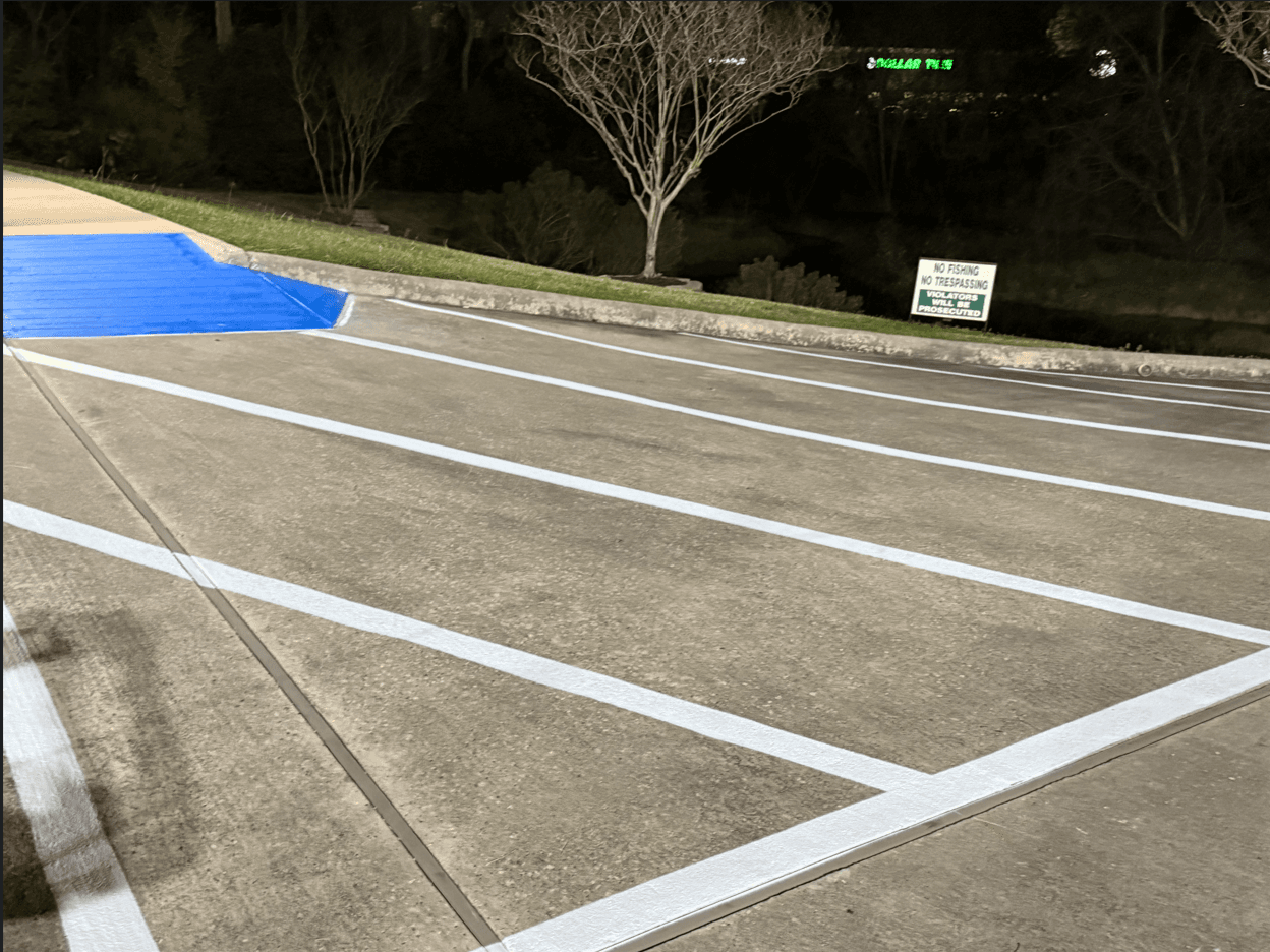 Freshly striped commercial parking lot by MSM Services Texas