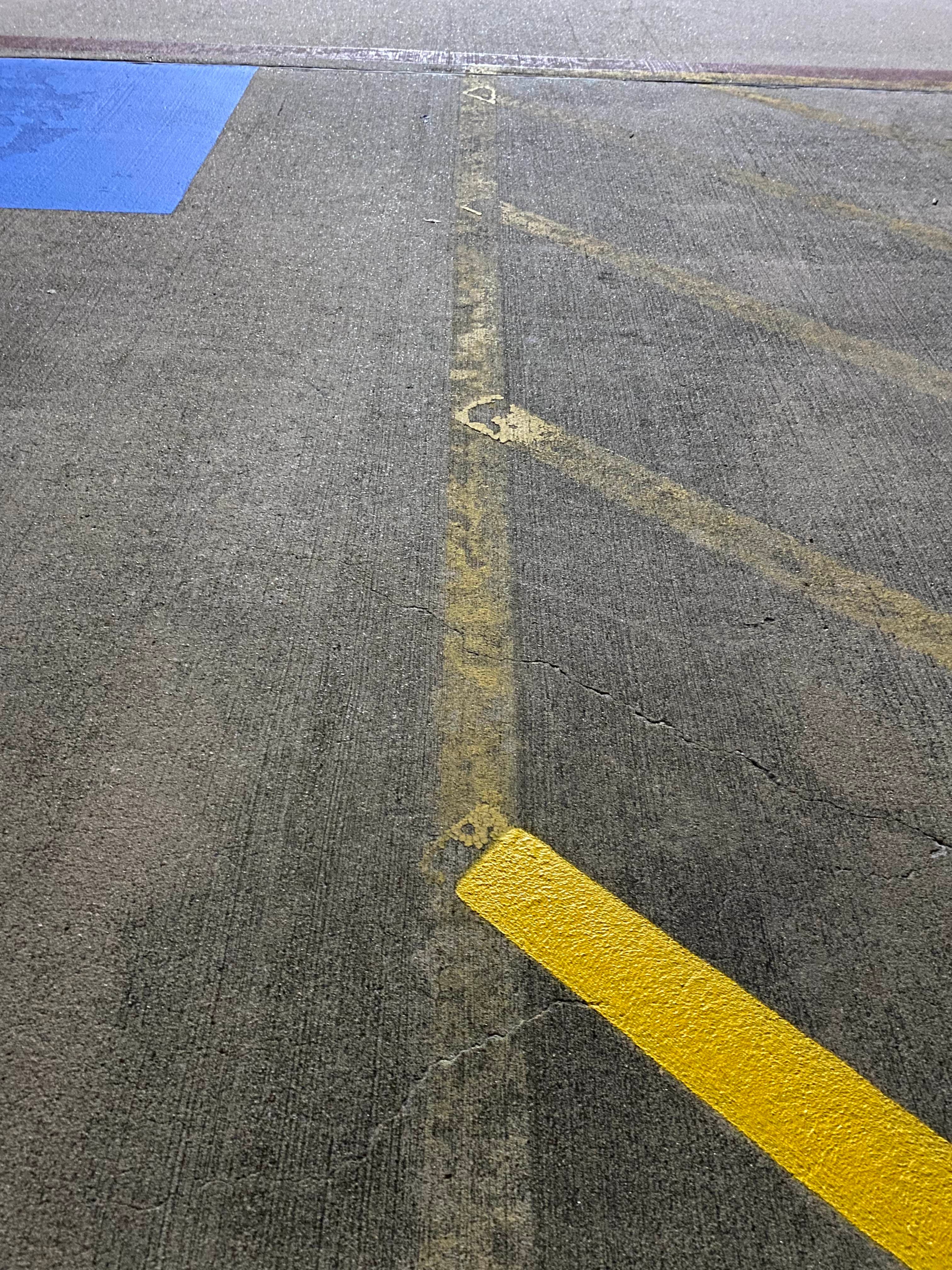 Fresh yellow parking lot striping on commercial property